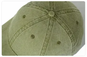 Close-up view of the washed cotton baseball cap top panel, showing neat stitching and eyelets.
