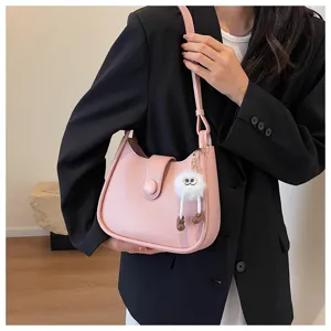 Stylish pink women shoulder bag minimalist bucket bag with cute fluffy charm for daily outfit