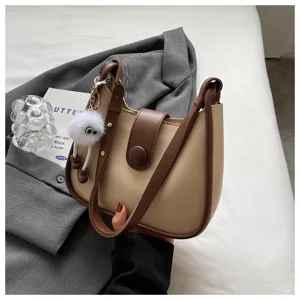 Chic contrast color women shoulder crossbody bag, stylish korean handbag with fluffy plush charm.