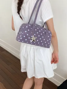 Sweet purple polka dot shoulder bag, trendy bowling handbag with star pendant for women main view.