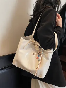 Large capacity casual PU leather tote bag for women, stylish minimalist shoulder commuting bag.