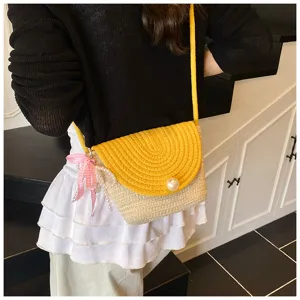 Handmade woven straw crossbody bag with yellow flap and cute pearl bow detail for women