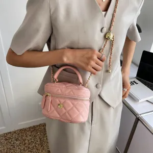 Pink quilted vanity shoulder bag for women, stylish mini crossbody bag with gold chain strap.