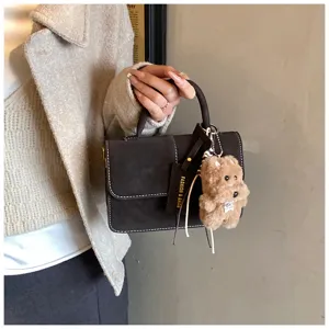 Women fashion retro matte handbag with cute plush bear keychain, versatile cross body square bag.