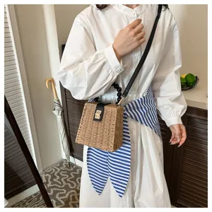 Retro woven straw crossbody bag with bead strap and metal lock clasp for women beach daily.