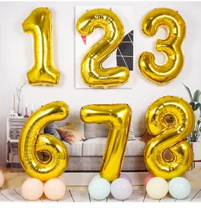 Gold digital foil balloons for birthday party decoration, shiny 32-inch numbers for celebration.
