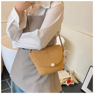 Handmade woven mini crossbody bag detail, chic straw phone shoulder bag for women daily wear.