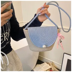 Woven crossbody bag for women, handmade blue and beige mini shoulder bag with pearl decor.