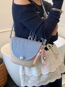 Korean style handmade woven mini shoulder bag with pearl closure and pink ribbon for women