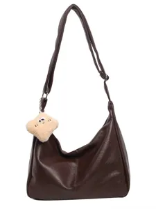 Dark brown faux leather slouchy shoulder bag with plush charm, large capacity hobo bag.