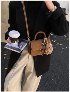 Fashion retro matte crossbody handbag with cute bear pendant and scarf, stylish autumn winter bag.