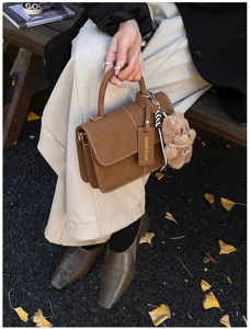 Retro brown matte leather handbag and crossbody bag for women, stylish autumn design.