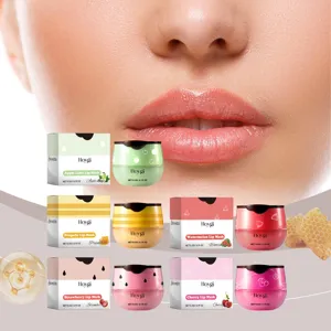 Close-up details of HOYGI fruit-scented lip mask jars and packaging with smooth model lips.