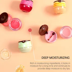Detail view of fruity lip mask jars with applicator spoon, smooth and moisturizing formula.