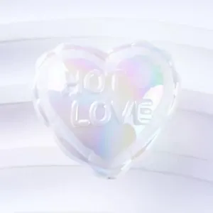 Holographic heart pendant detail, iridescent acrylic craft accessory with debossed love text.