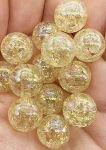 Close-up detail of yellow crackle acrylic round beads with AB colorful coating for DIY.