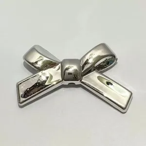 Silver UV plated bow knot pendant detail, ideal for DIY handmade phone charm bead materials.