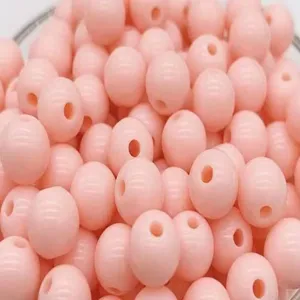 Pink acrylic smooth round beads detail shot, ideal for DIY jewelry crafting and bracelet making.