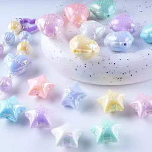 Pastel acrylic star and heart beads with UV plating, perfect for DIY jewelry making crafts.