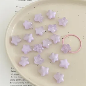 Acrylic glitter star beads detail shot, cream purple DIY charm beads for handmade jewelry.