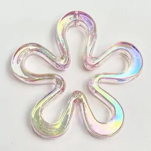 Iridescent flower bead charm detail close up, holographic UV plated acrylic DIY jewelry piece.