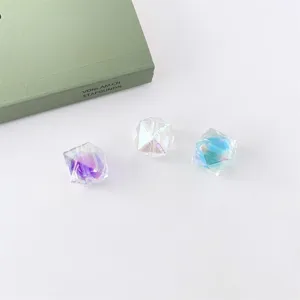 Close-up detail of shimmering multi-faceted acrylic beads with vibrant rainbow flash.