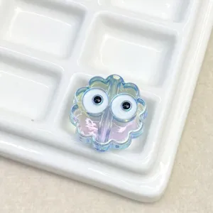 Iridescent UV transparent flower bead with cute googly eyes for DIY phone charms and jewelry.