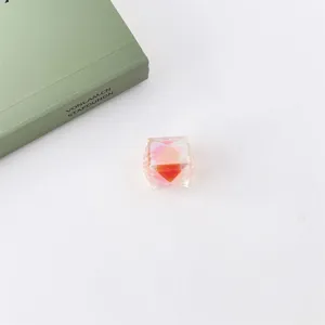Detailed shot of iridescent UV coated acrylic diamond cut loose bead for DIY jewelry.