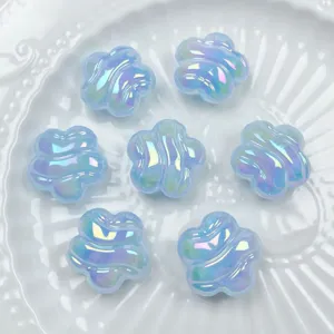 Close up of light blue iridescent acrylic plum blossom beads, perfect for DIY jewelry.