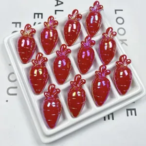 Close-up detail of shiny red acrylic carrot beads, perfect for DIY jewelry and craft projects.