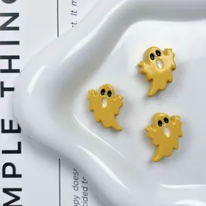 Primer plano de cuentas fantasma de acrílico amarillo para joyería DIY, dijes sueltos.