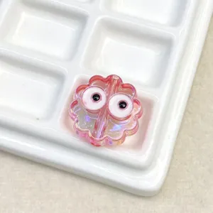 Close-up of cute pink translucent UV plated flower shaped diy bead charm detail view.