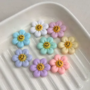 Colorful resin smiley flower charms for DIY jewelry making, cute bracelet crafting beads.