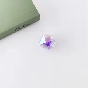 Detailed view of sparkling acrylic faceted loose bead with UV coating for DIY handmade craft.