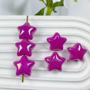 Close-up of 20mm shiny iridescent purple star acrylic loose beads for DIY handmade jewelry.