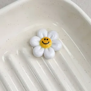 Colorful smiley flower resin DIY jewelry accessory for charm bracelets and hair clips.