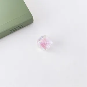 Detailed close-up of acrylic heart-core UV coated diamond-cut loose beads for DIY crafts.