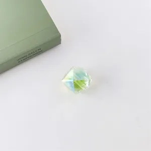 Close-up of iridescent faceted acrylic bead detailing unique multi-color reflection texture.