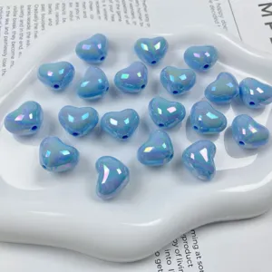 Closeup of blue AB iridescent heart acrylic beads, perfect for DIY jewelry making and phone chains.