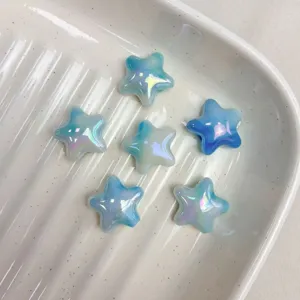 Close-up of blue gradient star loose beads showing AB iridescent finish and cloud details.
