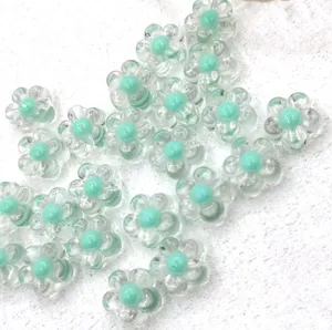 Transparent acrylic flower beads with mint green center for DIY jewelry and accessories.