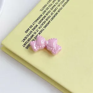 Pink acrylic double-layer bowknot DIY accessory for phone chain keychain hair clip crafts.