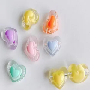 Detailed view of colorful 3D acrylic heart beads, perfect for DIY bracelets and hair ties.