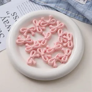 Perles noeud etoile en acrylique rose pour accessoires de bijou chaine telephone detail.