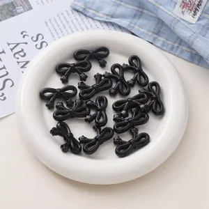 Perles nœud étoile en acrylique noir détail, parfait pour bijoux DIY et chaînes de téléphone.