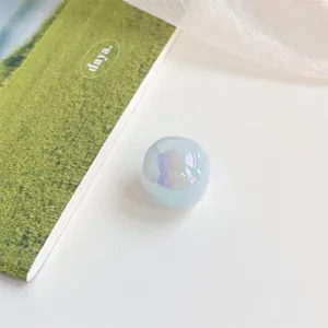 Acrylic iridescent shell color large hole round bead DIY phone charm accessory detail view.