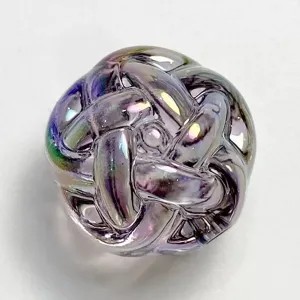 Close-up of a colorful UV electroplated acrylic woven bead, glossy transparent DIY charm.