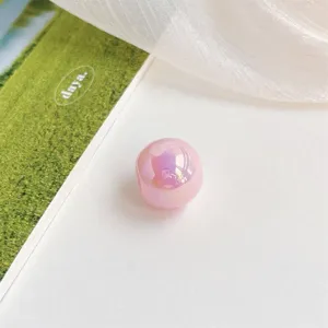 Detailed close-up shot of an acrylic iridescent candy color round loose bead for DIY jewelry making.