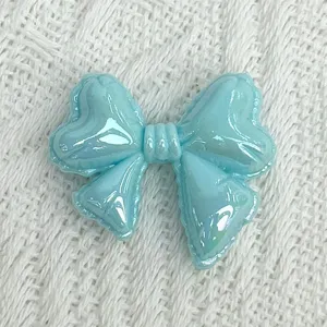 Detail image of light blue acrylic balloon bowknot charm for DIY jewelry making and bracelet beads