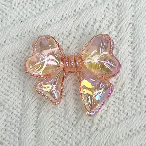 Transparent acrylic iridescent bow bead accessory for DIY summer bracelets jewelry making.